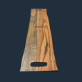 Load image into Gallery viewer, The Sophisticated Dining: Engraved Grazing Board is an elegant acacia wood serving piece featuring a natural grain. Handle cutouts on each end and its smooth dark finish make it the ideal entertaining accessory against a dark grey backdrop.