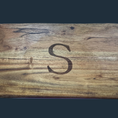 Load image into Gallery viewer, The Sophisticated Dining Engraved Grazing Board is crafted from rich acacia wood, featuring a prominent S engravement at its center. Its natural color and texture variations make it an exceptional entertaining accessory.